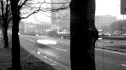 film still: Traffic speeds eastwards from the Plac Konstytucji, Warsaw

