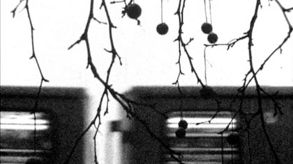 film still: Somewhere, elsewhere, outside (in this shot – Berlin), trains pass by

