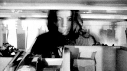 film still: Fraulein Stromkreis (Sarah Beauvoisin) focuses on the power supply

