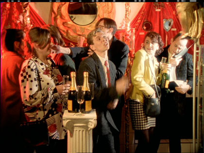 film still: The champers flows, the boom years begin…

