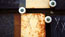 XXX a: This and the next two images
are from an evolving sequence toward the end of the film. A number of a particular type of plate have been merged into each other using simple dissolves – but in ‘framed’ areas of the image. These images all contain the strong feature of (actual) overlaid _scratched crosses_. Theses are used at the site to kick-start the processes of deterioration, but for me they suggest small signatures – little identity stamps.

