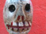 Hooked skull on red

